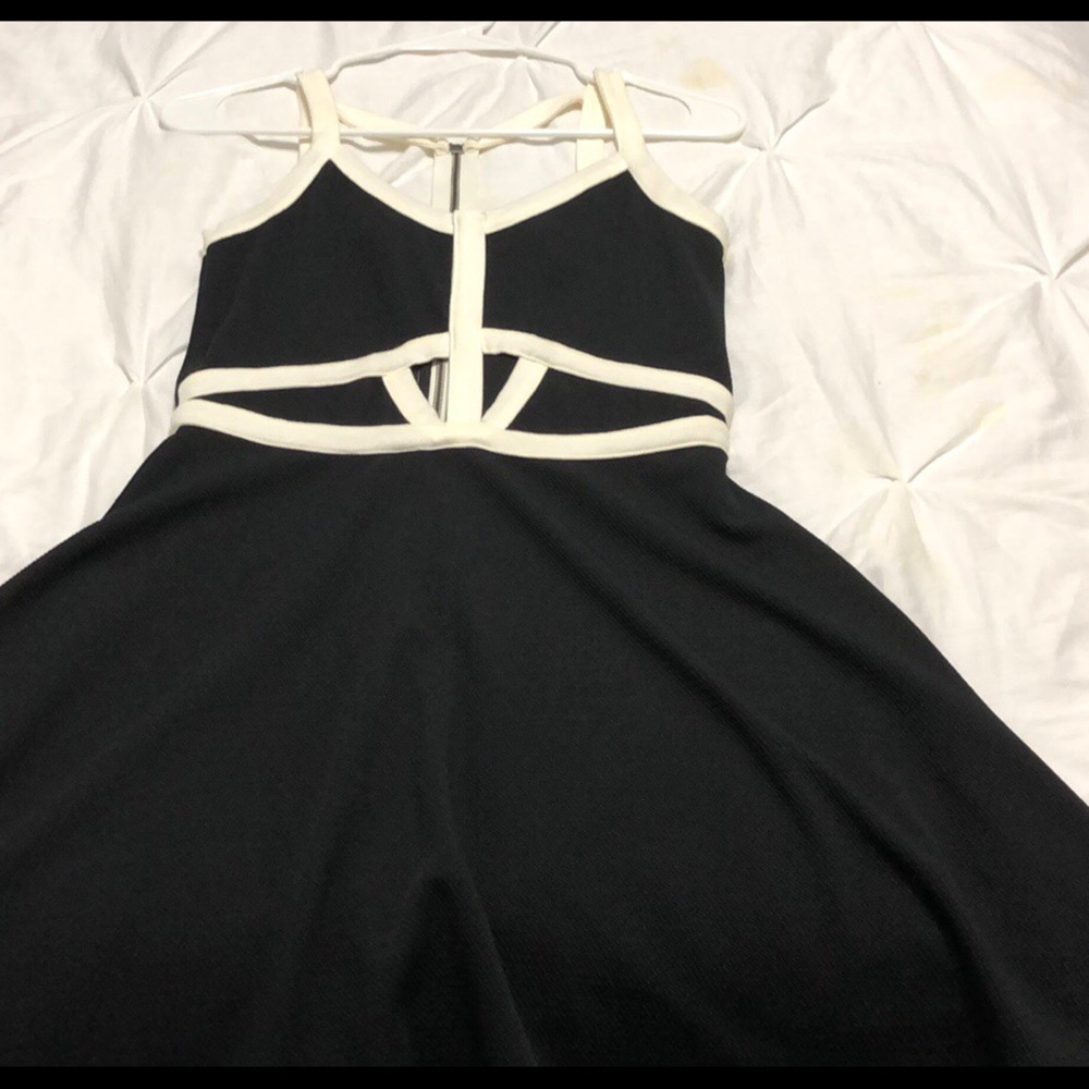 Vented black mini dress